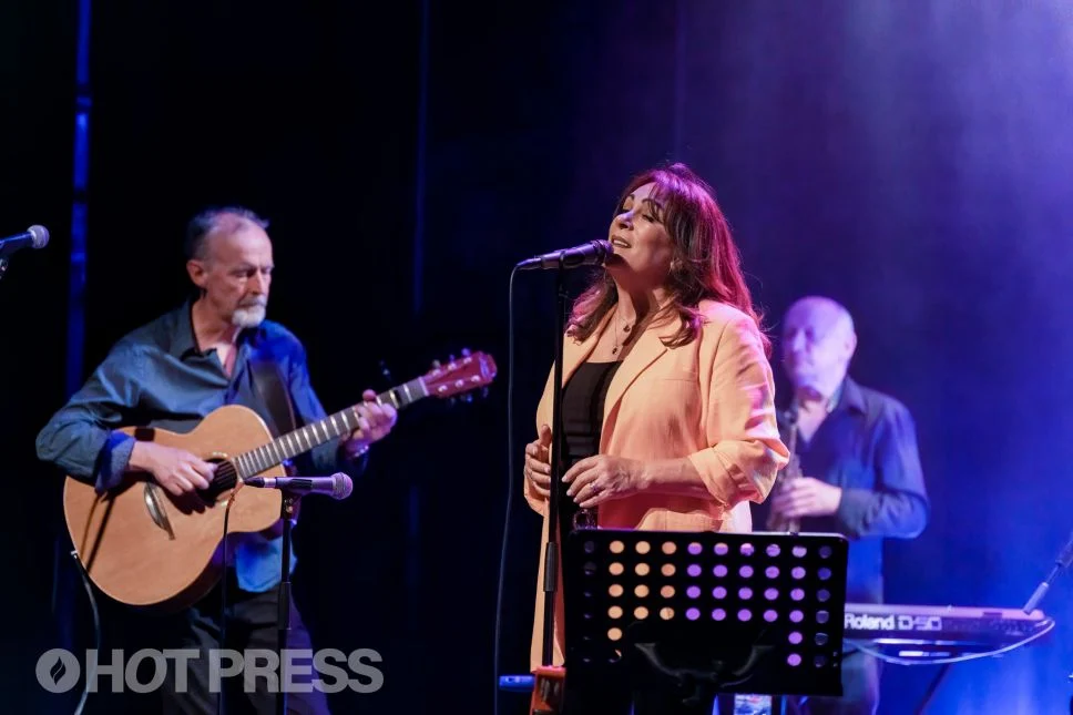 Mary on stage with Bill Shanley on her left and Richy Buckley behind her on the right.